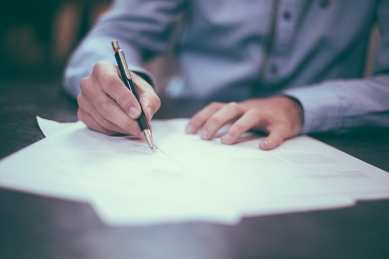 Person reviewing insurance documents at a desk